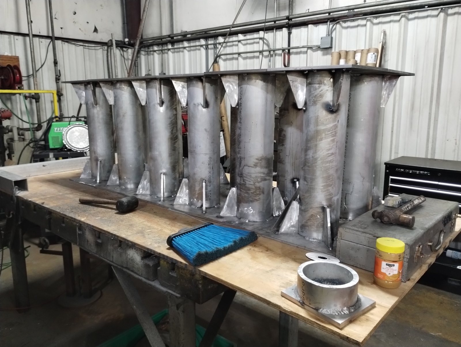 Custom metal parts laid out for finishing